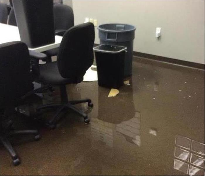 standing water in an office after storm damage
