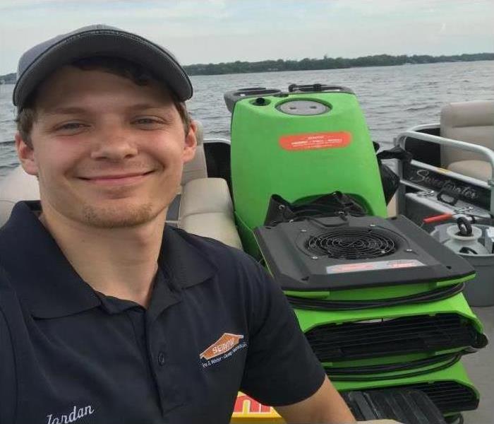 SERVPRO technician jordan on a boat with drying equipment